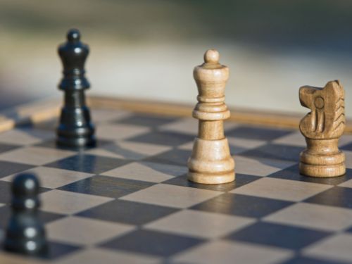 Chess pieces on the chess board